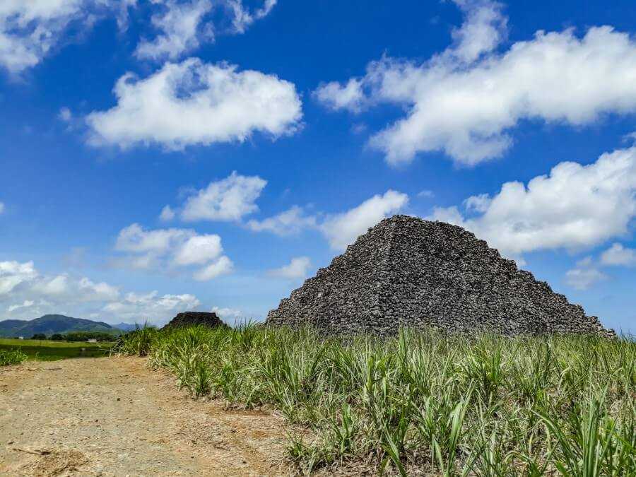 stone pyramids in the middle of a sugar cane field in Mauritius