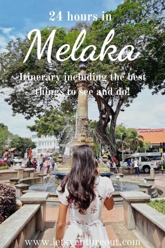 a woman in white floral dress walking toward a water fountain at Dutch Square Melaka