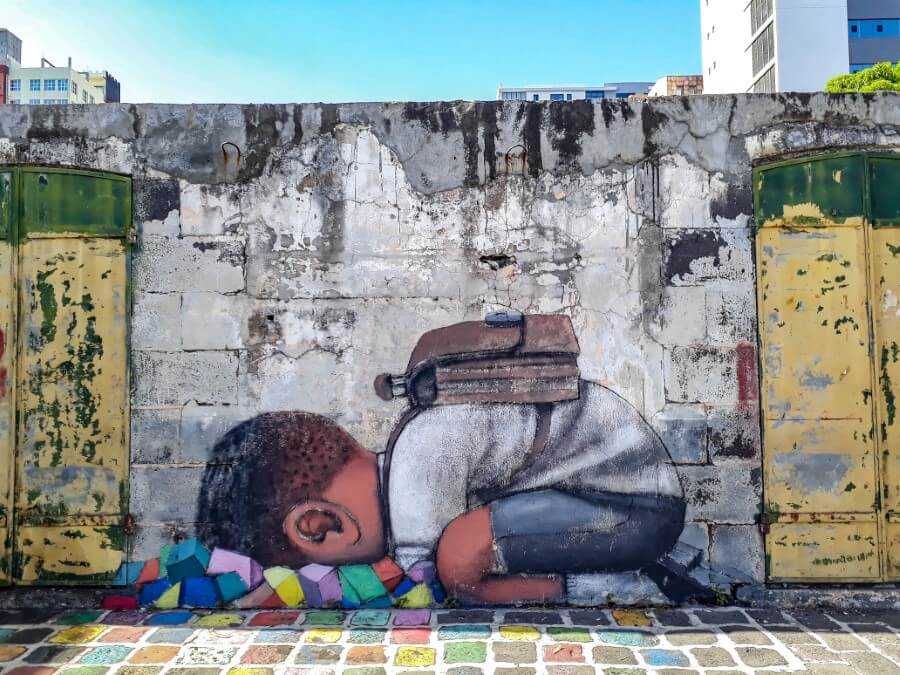 school kid's head under the pavement art