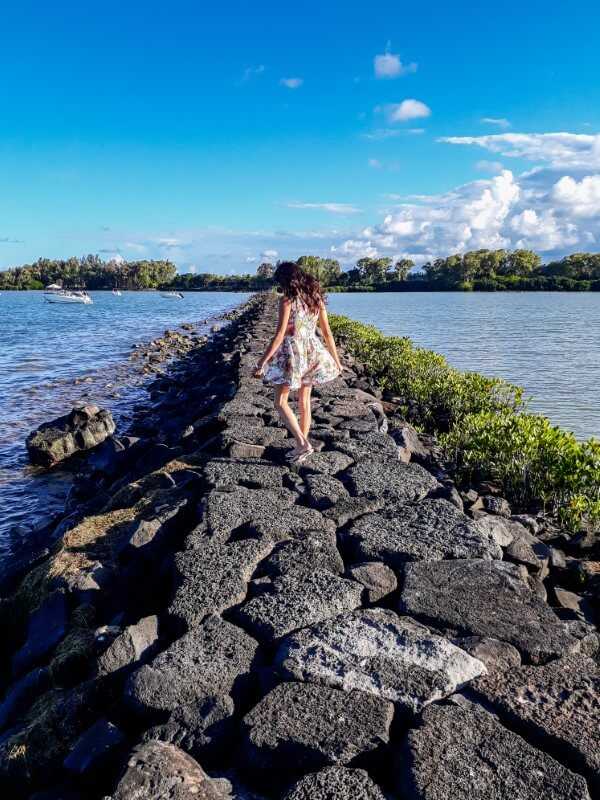 Girl walking along Azuri Village in Mauritius