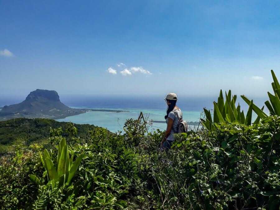 Girl looking over Le Morne Brabant at Ebony Forest in Mauritius