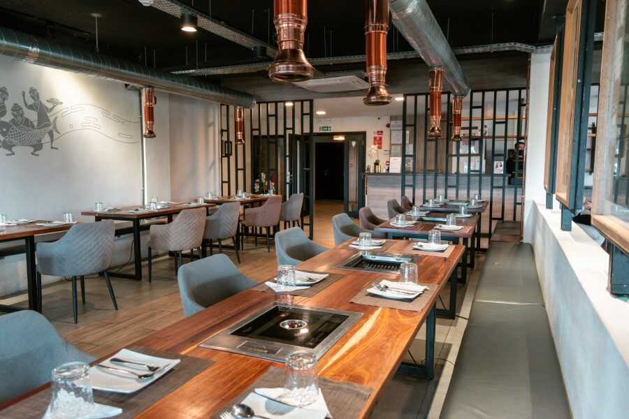 wooden tables and chairs at Kogi Kogi Korean BBQ Restaurant Mauritius Grand Baie
