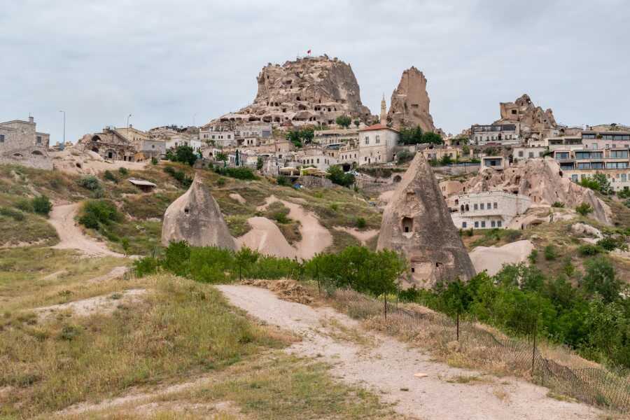 view of fairy chimneys with holes carved into the rocks at Uchisar - 3 days in Cappadocia