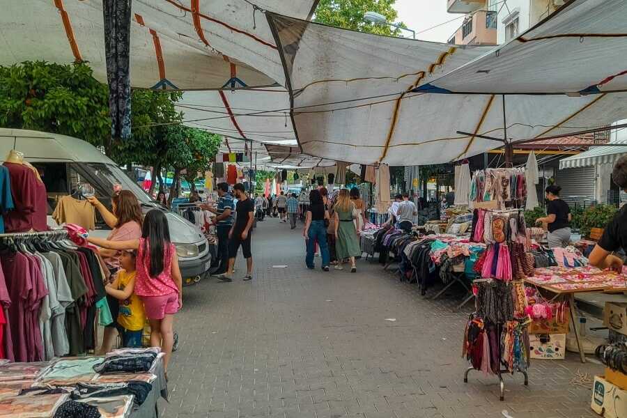 people shopping at a local market in selcuk
