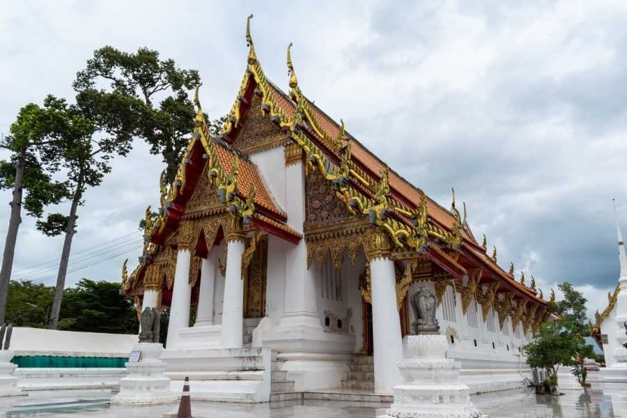 a white-washed temple with golden spires at Wat Kasattrathirat | day trip to Ayutthaya from Bangkok