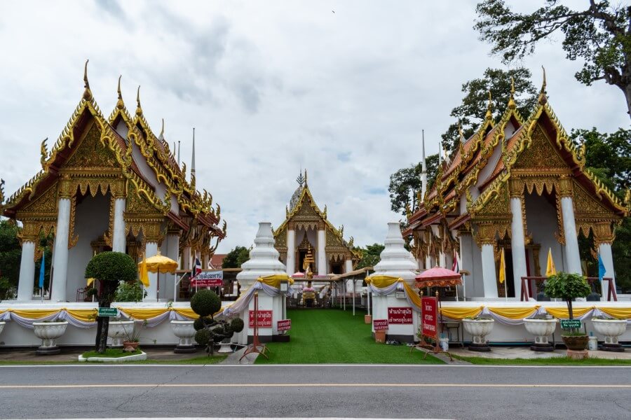 a white and gold temple complex at Wat Kasattrathirat ayutthaya