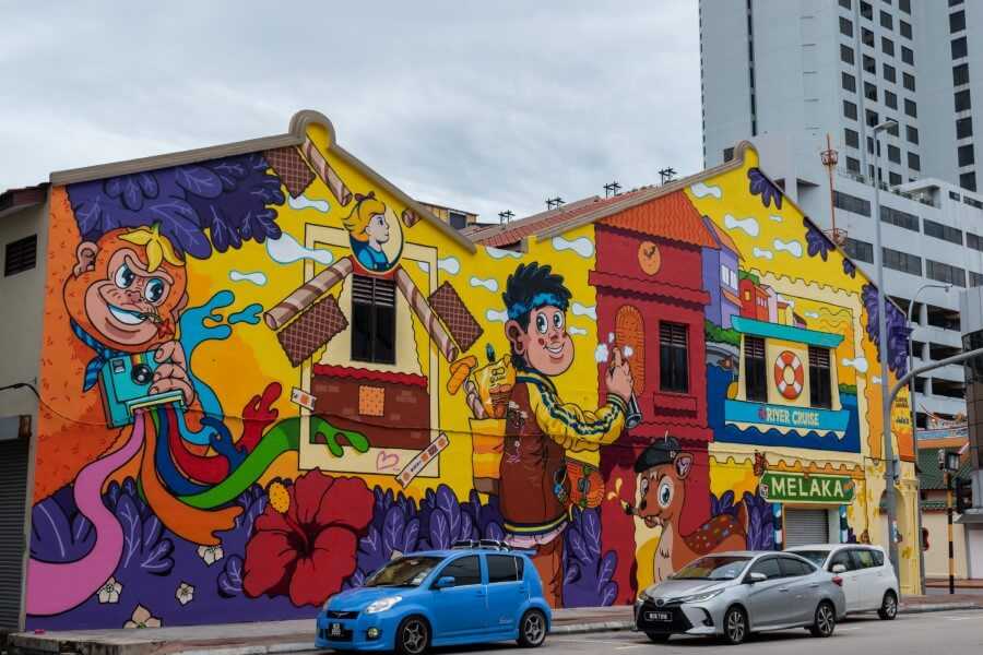 colorful street art on Jalan Munshi Abdullah Street illustrating a monkey, a boy and a girl