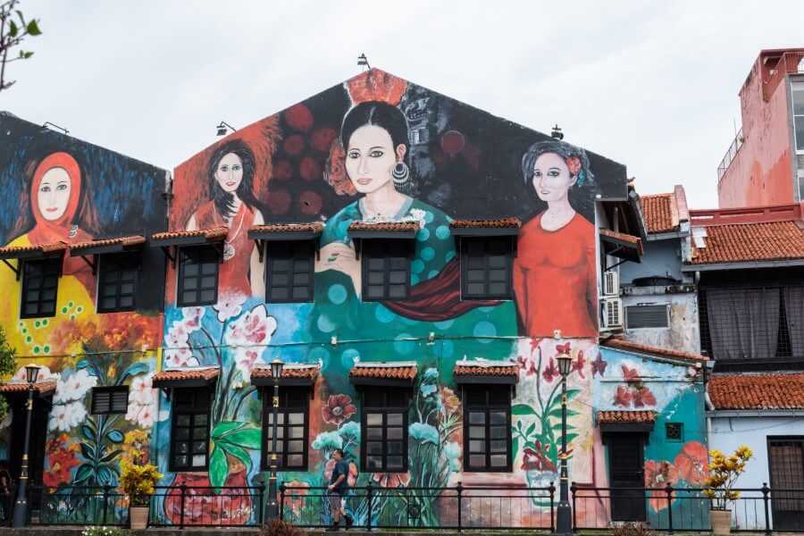 street art of women in traditional dresses