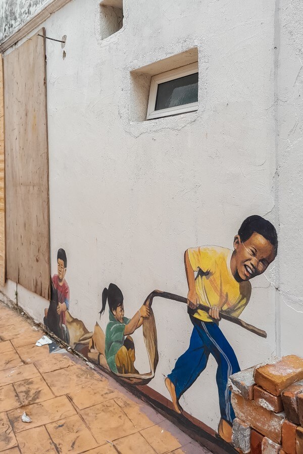 painting of kids playing