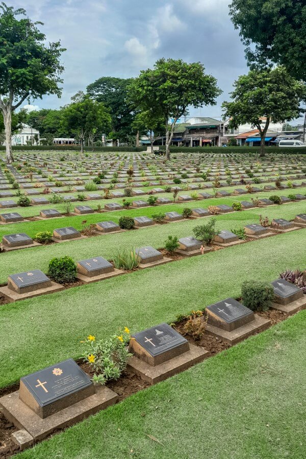 rows of tombstones at the war cemetery kanchanaburi
