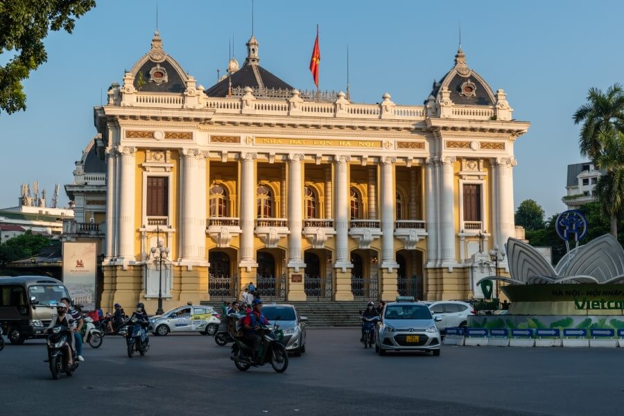 a french colonial building painted in yellow and white hanoi opera house vietnam