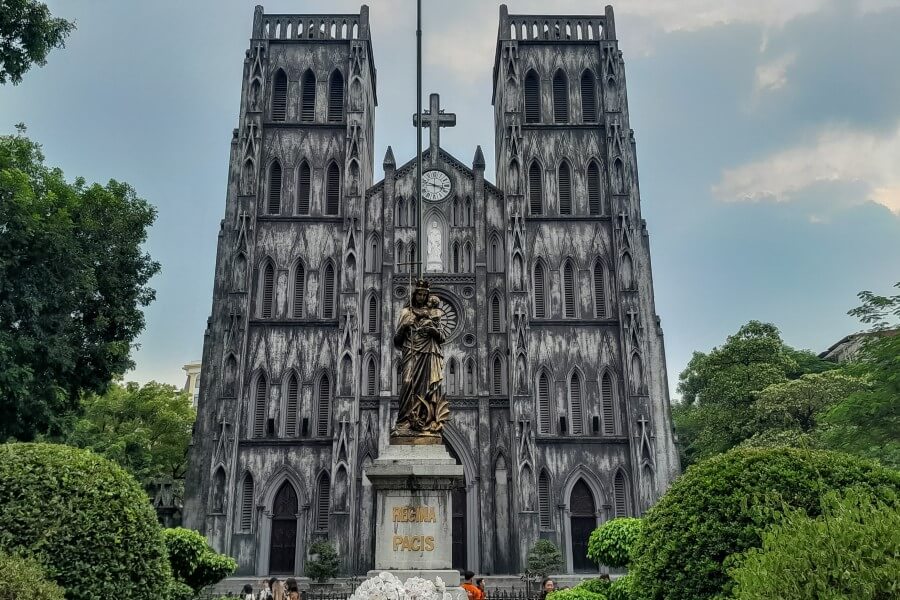 a statue of virgin mary in front of st joseph cathedral in hanoi | itinerary for north vietnam