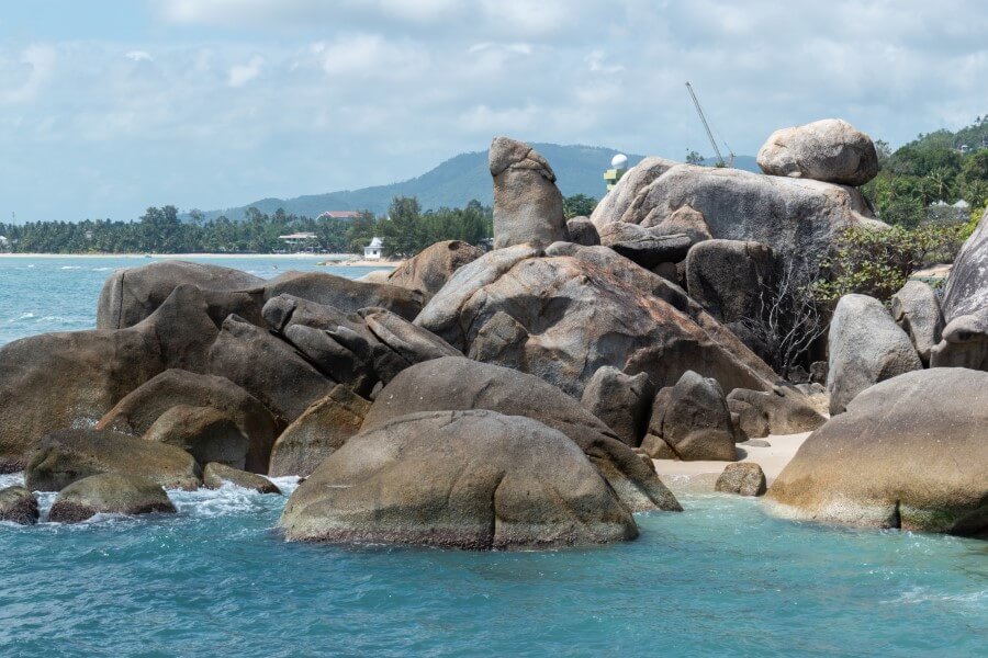 rocks stacked on top of each other on a beach in koh samui